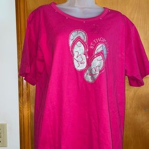 Pink T shirt with silver flip flops